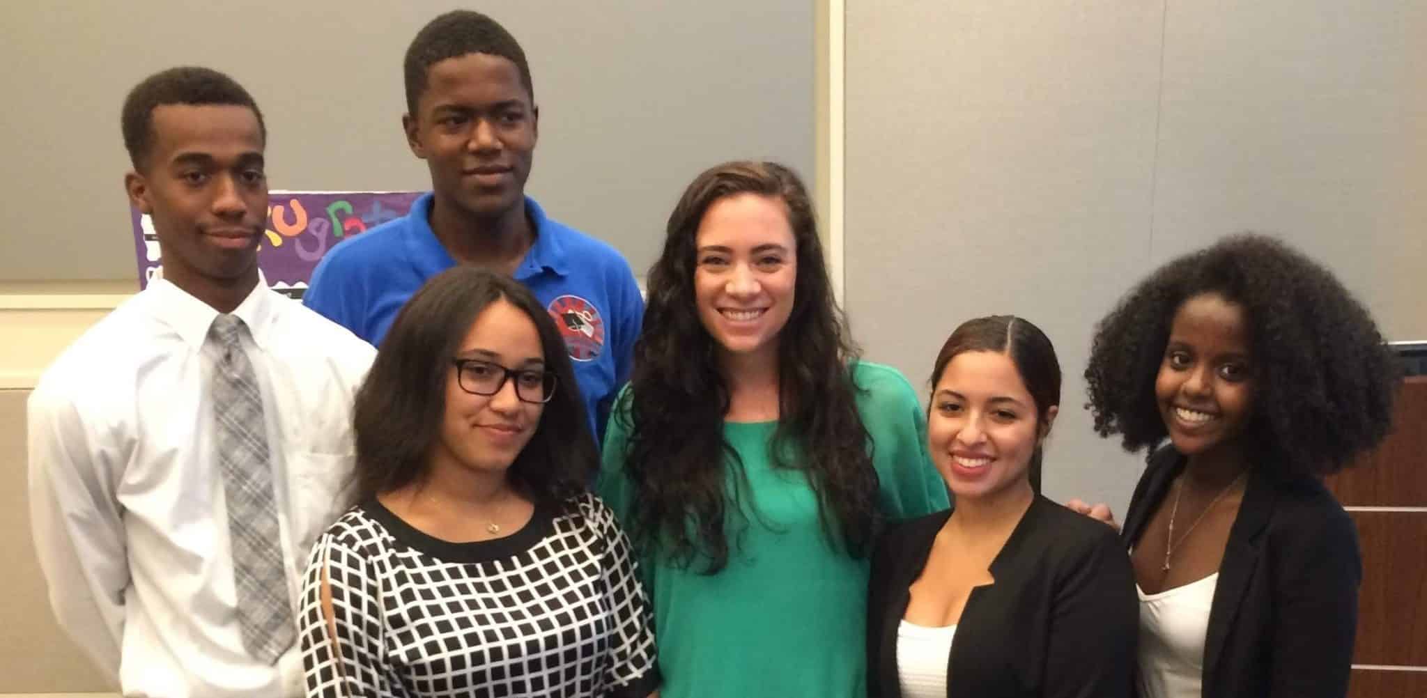 Photo of Ashley Ferrara with colleagues and students