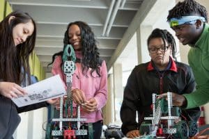 Ninth-grade students assemble robots at MC2 STEM High School.