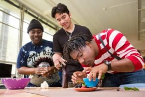 Students in a digital photography class create fake ice cream for a photo shoot.