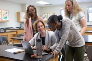 Four Teachers at Laptop