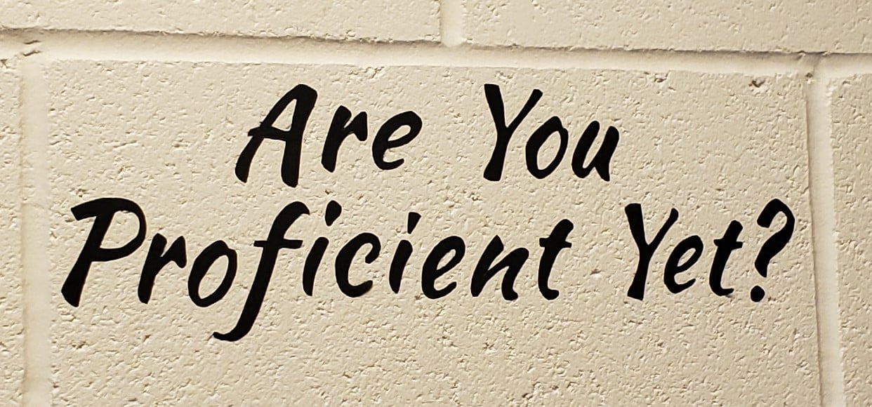 Sign on Wall That Says Are You Proficient Yet