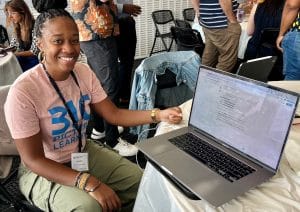 A women shows her AI design sprint product