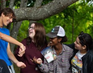 Students looking at each other smiling and laughing