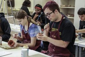 Students Glazing Ceramics