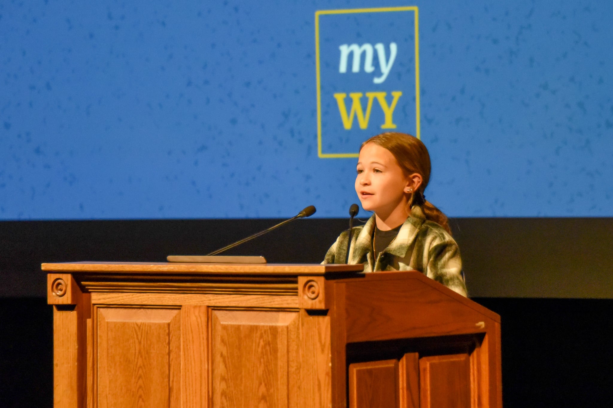 Wyoming student presenting at a podium