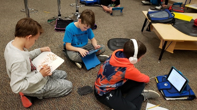 Harrisburg Students Working on Floor, Three Boys