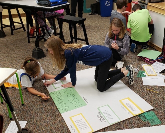 Harrisburg Students Working on Floor, Three Girls