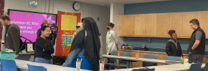 Students in a classroom talking in pairs