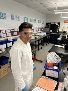 Students conducts science experiment at Chelsea Opportunity Academy (COA). 