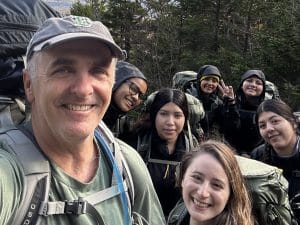 Ron with COA students on a hiking trip