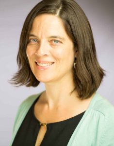 Headshot of Laurie Gagnon, CompetencyWorks program director. Laurie smiles at the camera wearing a black top and light green sweater.