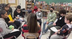 Students at Brooklyn Collaborative sitting in circle talking