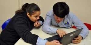 Student and Teacher at Laptop