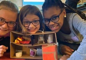 Three girls smiling