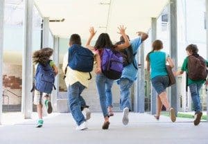 Students running down hall