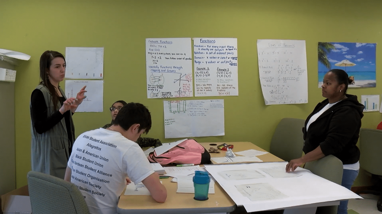 Teacher Working on Math With Students