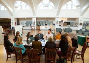 Educators at Conference Table in Library