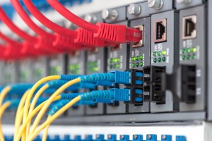 Fiber Optic cables connected to an optic ports and UTP Network c