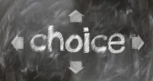 Choices with four arrows on a chalkboard