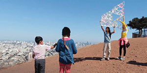 Four children with a kite