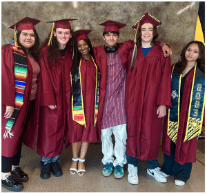 Students posing together after graduation