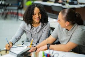 Student and Teacher Looking at Each Other