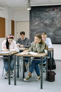 students at desks in a classroom