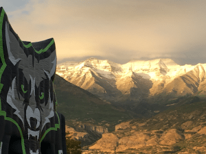 Timpanogos High School Mascot, a wolf, with mountains in the distance. 